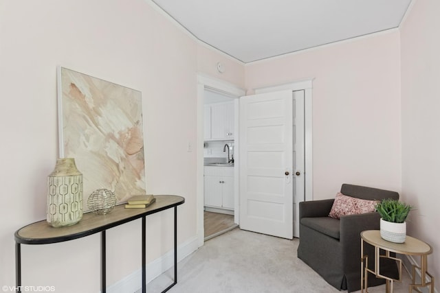 2635 Poplar Ave, Evanston, IL 60201 - sitting room featuring light colored carpet and ornamental molding