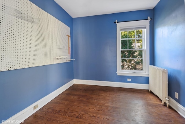 2635 Poplar Ave, Evanston, IL 60201 - empty room with radiator and wood finished floors