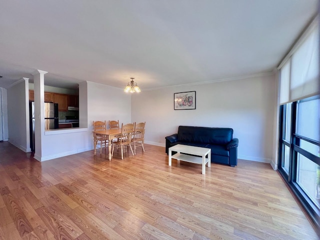 3001 S Michigan Ave Unit 909, Chicago, IL 60616 - dining room featuring light wood finished floors, a chandelier, and ornamental molding