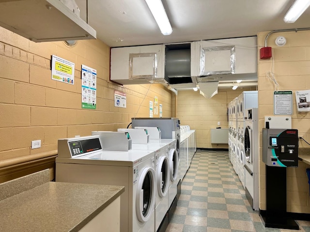 3001 S Michigan Ave Unit 909, Chicago, IL 60616 - community laundry room with washing machine and dryer, tile patterned floors, and stacked washer / drying machine