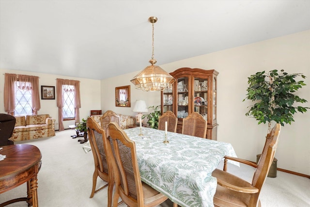 9242 Pembrooke Ln, Orland Park, IL 60462 - dining space featuring light carpet and a chandelier