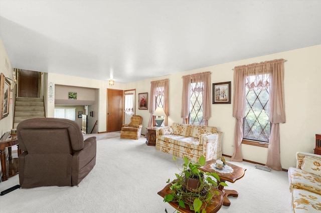 9242 Pembrooke Ln, Orland Park, IL 60462 - living area with carpet, plenty of natural light, and stairs
