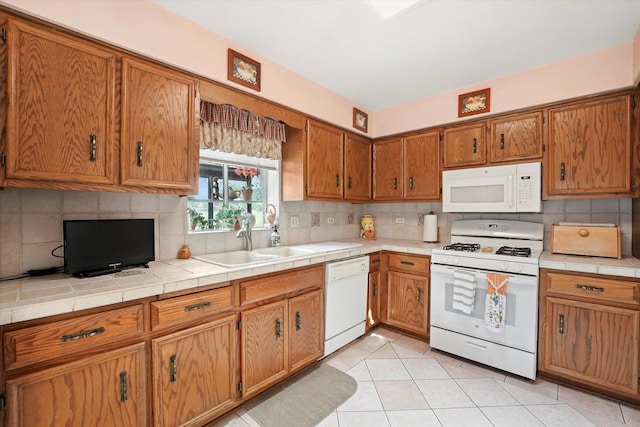9242 Pembrooke Ln, Orland Park, IL 60462 - kitchen with white appliances, brown cabinets, decorative backsplash, and light tile patterned flooring