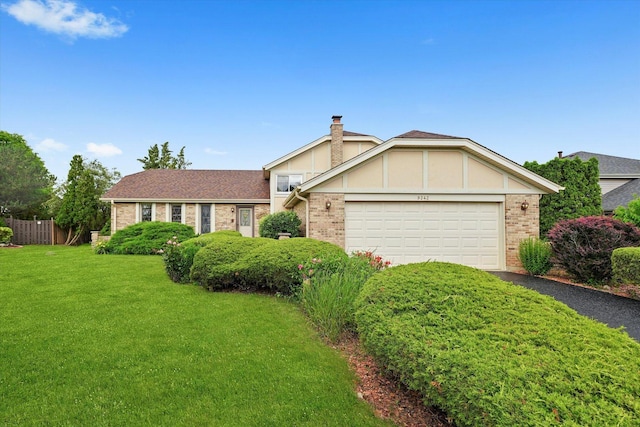 9242 Pembrooke Ln, Orland Park, IL 60462 - view of front of house featuring brick siding, driveway, an attached garage, and a chimney