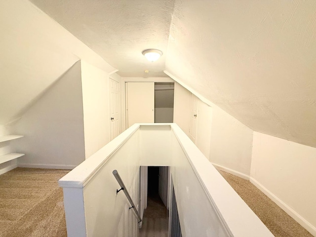 1318 Pine Grove Ave, Round Lake Beach, IL 60073 - stairway with carpet floors, a textured ceiling, and vaulted ceiling