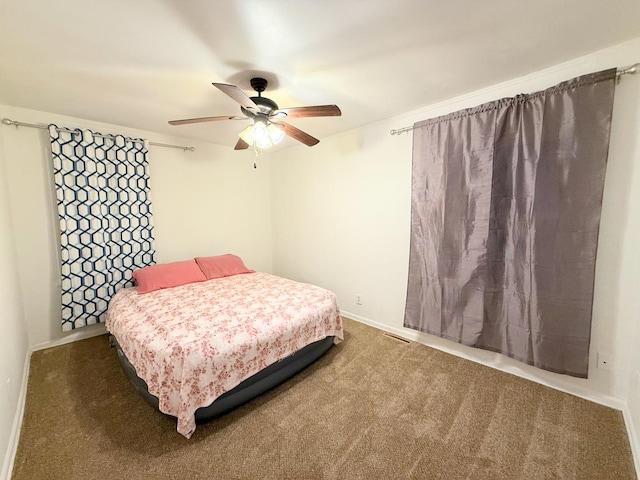 1318 Pine Grove Ave, Round Lake Beach, IL 60073 - carpeted bedroom with baseboards and ceiling fan