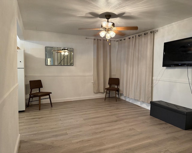 1318 Pine Grove Ave, Round Lake Beach, IL 60073 - living area featuring ceiling fan, wood finished floors, and crown molding