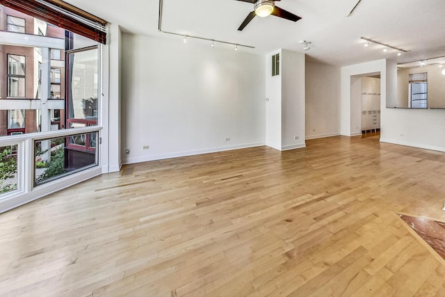 1223 W Cottage Pl, Chicago, IL 60607 - unfurnished room featuring track lighting, plenty of natural light, and ceiling fan