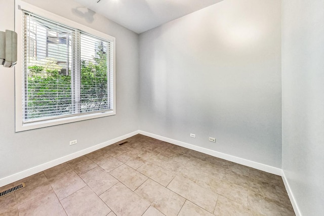 1223 W Cottage Pl, Chicago, IL 60607 - tiled empty room with baseboards