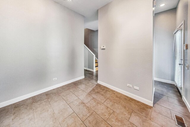 1223 W Cottage Pl, Chicago, IL 60607 - unfurnished room featuring tile patterned flooring and stairs