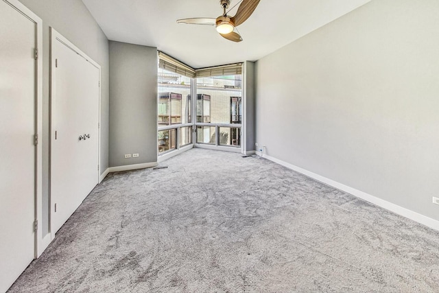 1223 W Cottage Pl, Chicago, IL 60607 - unfurnished bedroom with carpet flooring, expansive windows, and ceiling fan
