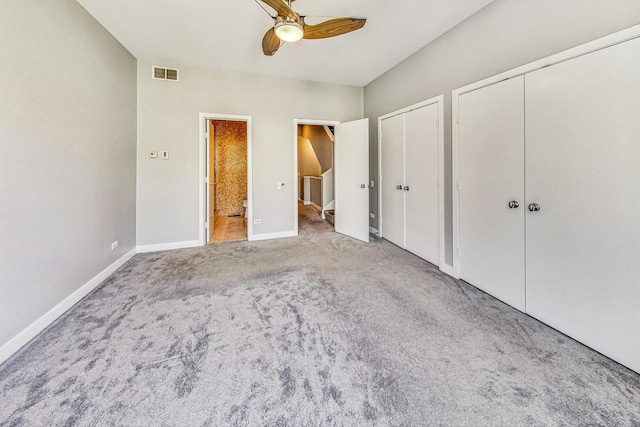 1223 W Cottage Pl, Chicago, IL 60607 - unfurnished bedroom with two closets, carpet floors, ensuite bath, and a ceiling fan