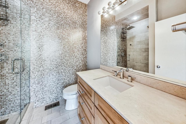 1223 W Cottage Pl, Chicago, IL 60607 - bathroom featuring vanity, tile patterned floors, a shower stall, and tile walls