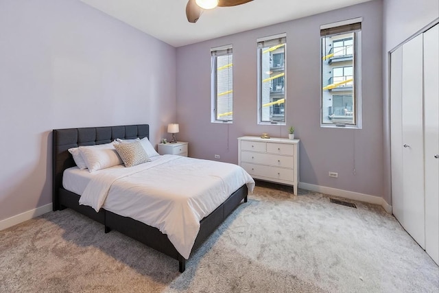 1223 W Cottage Pl, Chicago, IL 60607 - bedroom with multiple windows, light carpet, and a closet