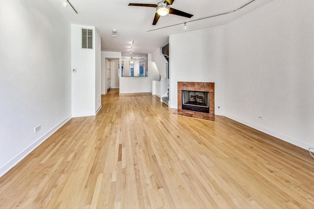 1223 W Cottage Pl, Chicago, IL 60607 - unfurnished living room with a ceiling fan, track lighting, and light wood-style floors