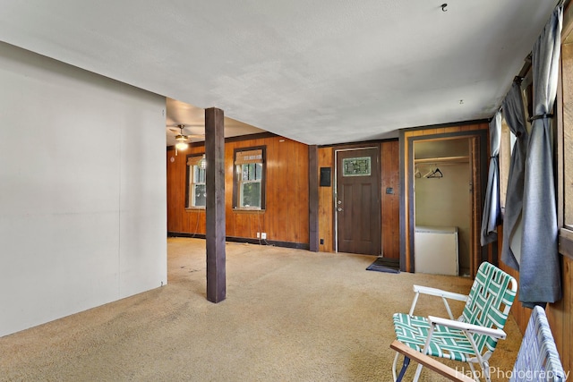 35835 N Ash St, Ingleside, IL 60041 - foyer featuring carpet flooring, wood walls, and ceiling fan