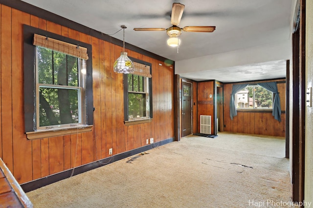35835 N Ash St, Ingleside, IL 60041 - unfurnished room featuring wood walls, carpet floors, and ceiling fan