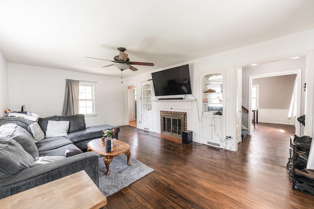1020 N 8th St, Rochelle, IL 61068 - living room with wood finished floors, ceiling fan, and a brick fireplace