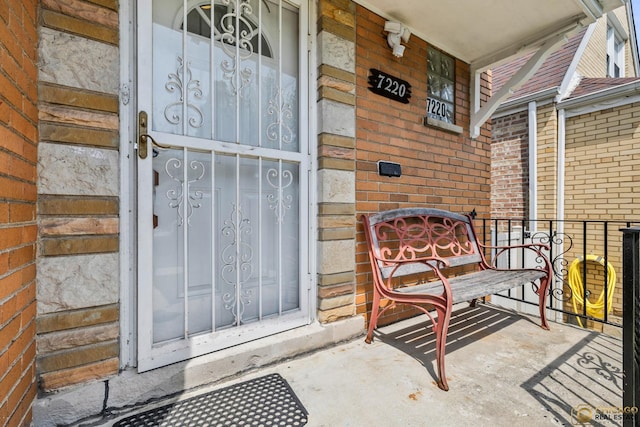 7220 S Spaulding Ave, Chicago, IL 60629 - view of exterior entry featuring brick siding and covered porch