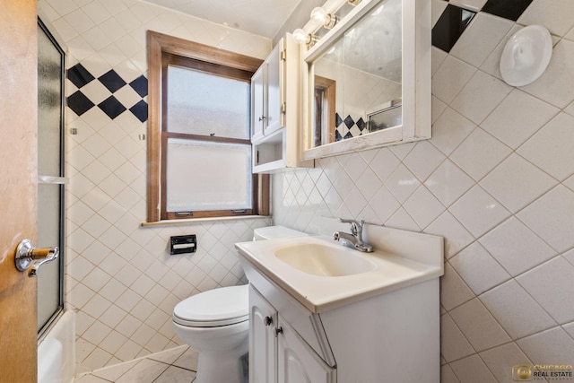 7220 S Spaulding Ave, Chicago, IL 60629 - full bathroom featuring tile walls, vanity, shower / bath combination with glass door, and tile patterned flooring