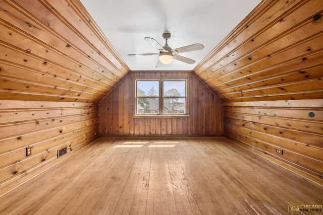7220 S Spaulding Ave, Chicago, IL 60629 - additional living space with wooden walls, light wood-type flooring, vaulted ceiling, and ceiling fan