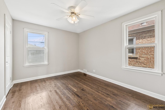 7220 S Spaulding Ave, Chicago, IL 60629 - empty room with dark wood-style floors and a ceiling fan