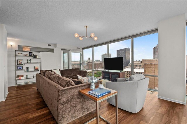 800 Elgin Rd Unit 1021, Evanston, IL 60201 - living area with dark wood-style floors, a textured ceiling, a chandelier, and expansive windows