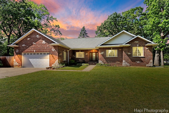 1340 Park Ave, Winthrop Harbor, IL 60096 - ranch-style home with brick siding, a yard, an attached garage, and driveway