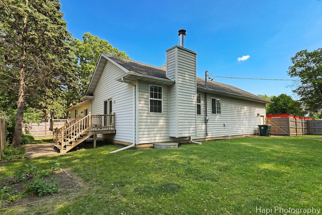 1340 Park Ave, Winthrop Harbor, IL 60096 - back of property featuring a chimney and a shingled roof
