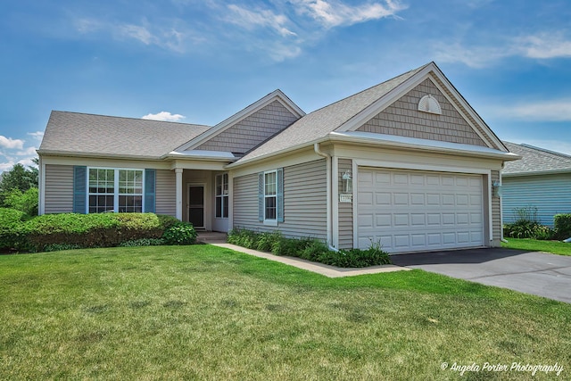 13399 Glenwood Dr, Huntley, IL 60142 - ranch-style house featuring a front yard, an attached garage, driveway, and a shingled roof