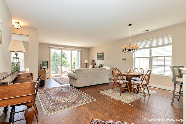 13399 Glenwood Dr, Huntley, IL 60142 - living area featuring wood finished floors and a chandelier