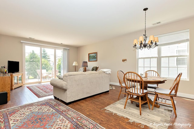 13399 Glenwood Dr, Huntley, IL 60142 - living area with a chandelier and wood finished floors