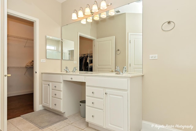 13399 Glenwood Dr, Huntley, IL 60142 - bathroom featuring double vanity, a spacious closet, and tile patterned flooring