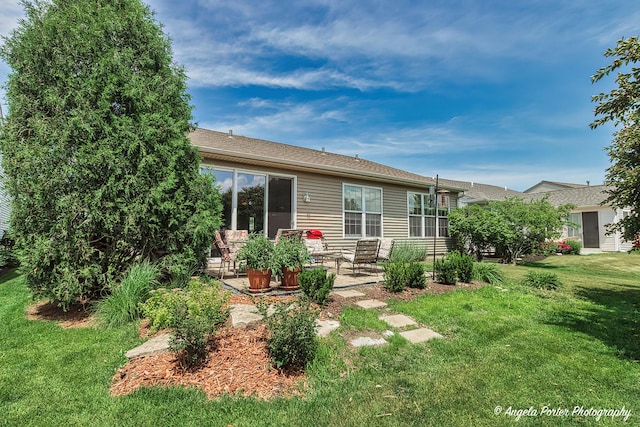 13399 Glenwood Dr, Huntley, IL 60142 - back of property with a patio and a lawn
