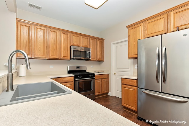 13399 Glenwood Dr, Huntley, IL 60142 - kitchen with appliances with stainless steel finishes, dark wood finished floors, and light countertops