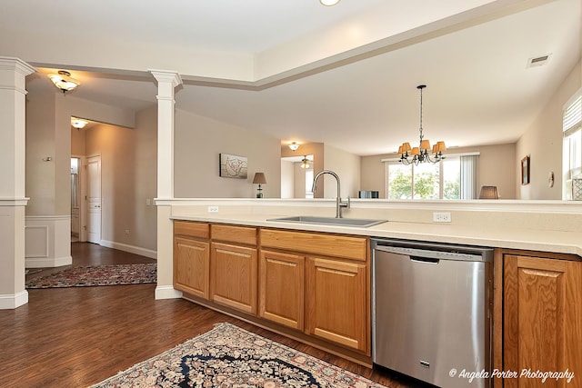 13399 Glenwood Dr, Huntley, IL 60142 - kitchen with stainless steel dishwasher, dark wood-type flooring, light countertops, brown cabinetry, and a chandelier