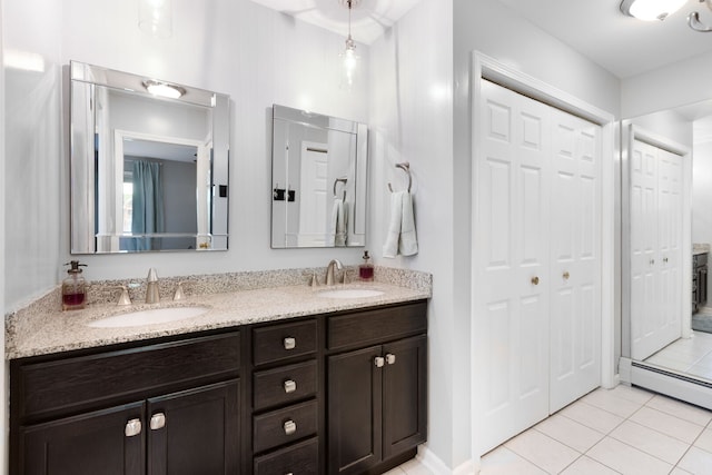1060 Highland Ave, Lake Forest, IL 60045 - full bath with double vanity, tile patterned floors, a closet, and baseboard heating