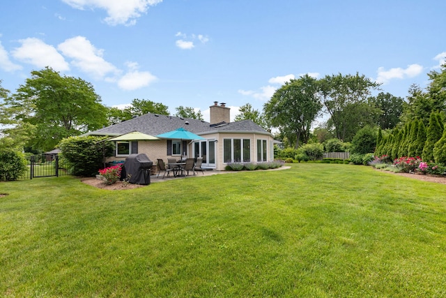 1060 Highland Ave, Lake Forest, IL 60045 - rear view of house with a patio and a chimney