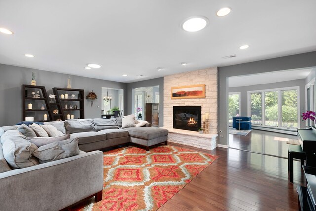 1060 Highland Ave, Lake Forest, IL 60045 - living area featuring a baseboard heating unit, wood finished floors, a fireplace, and recessed lighting
