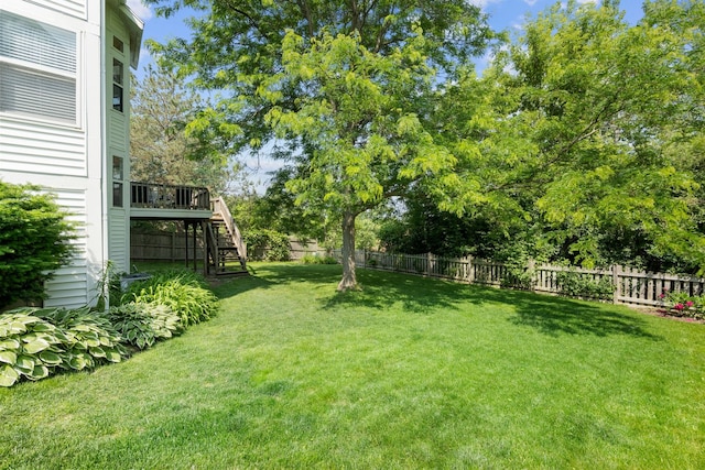 1361 Amherst Ct, Grayslake, IL 60030 - fenced backyard featuring stairs, a deck, and view of scattered trees