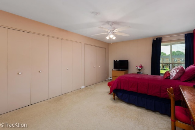 1056 N Mill St Unit 305, Naperville, IL 60563 - bedroom featuring carpet floors, multiple closets, and ceiling fan