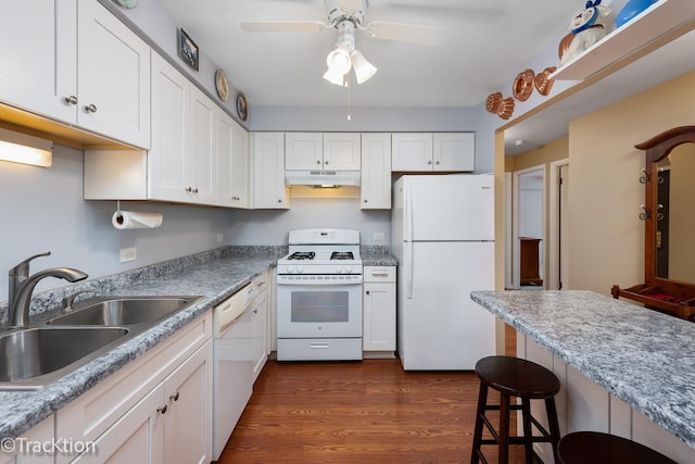 1056 N Mill St Unit 305, Naperville, IL 60563 - kitchen featuring white appliances, under cabinet range hood, white cabinets, a breakfast bar, and a ceiling fan