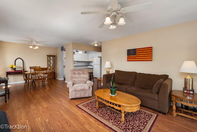 1056 N Mill St Unit 305, Naperville, IL 60563 - living room featuring ceiling fan and light wood-style flooring