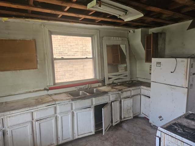 605 E 92nd Pl, Chicago, IL 60619 - kitchen featuring unfinished concrete floors, white appliances, light countertops, and white cabinetry