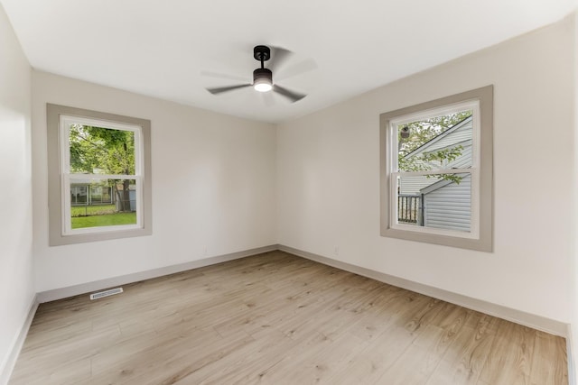 519 Everette Ave, Romeoville, IL 60446 - empty room featuring healthy amount of natural light, light wood-style flooring, and ceiling fan