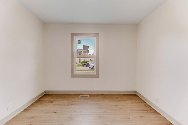 519 Everette Ave, Romeoville, IL 60446 - spare room with light wood-type flooring and baseboards
