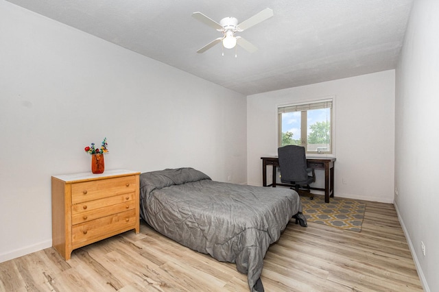 3020 Timber Hill Ct, Aurora, IL 60504 - bedroom with light wood-style floors and an office area