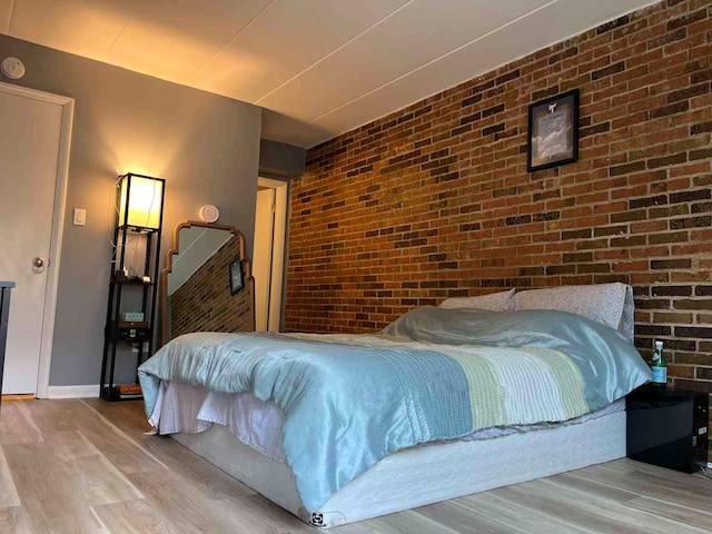 900 S River Rd Unit 3A, Des Plaines, IL 60016 - bedroom with wood finished floors and brick wall