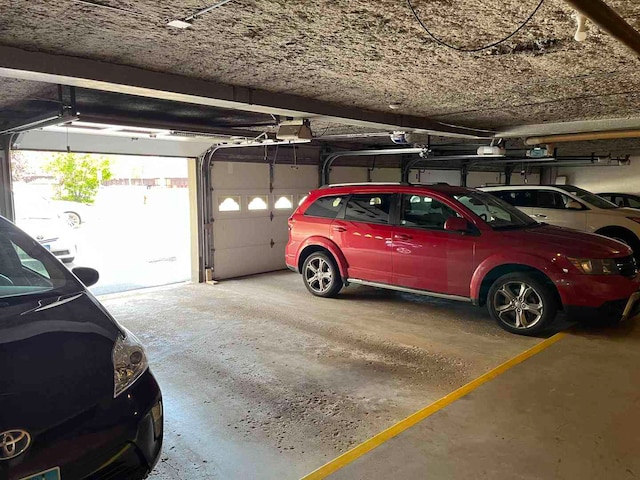 900 S River Rd Unit 3A, Des Plaines, IL 60016 - parking deck featuring a garage door opener