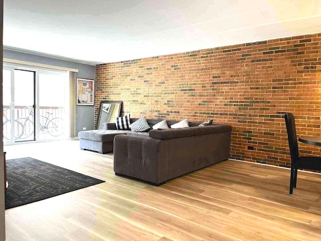 900 S River Rd Unit 3A, Des Plaines, IL 60016 - living area with wood finished floors and brick wall